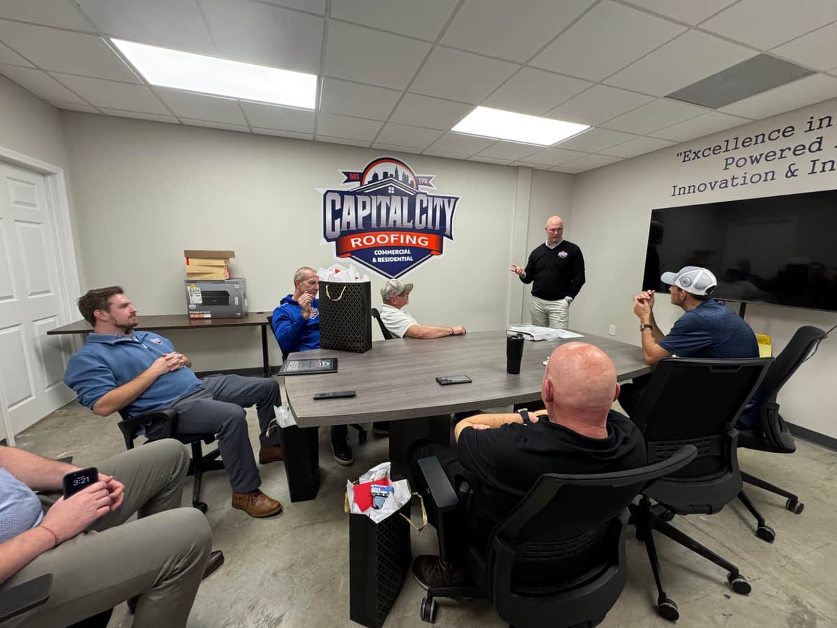 The Capital City Roofing team in a daily huddle